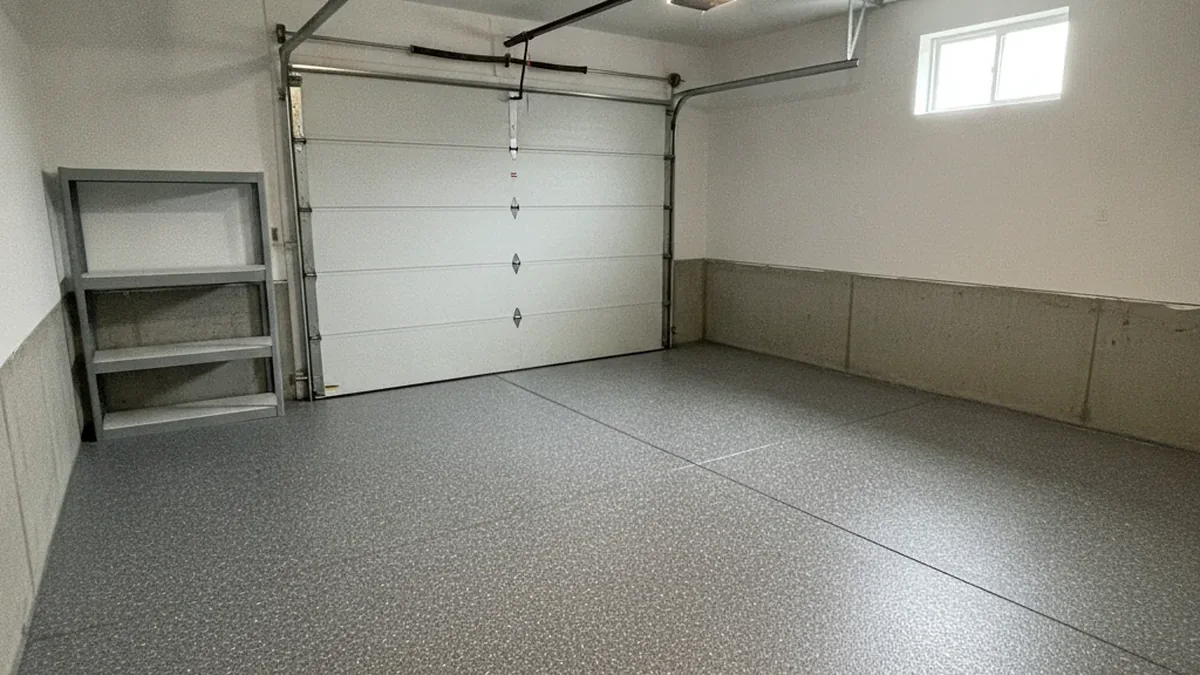 Finished flake garage floor coating in a Joliet residential garage with clear vehicle space.